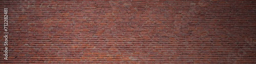 Backsteinwand mit roter Farbe als Hintergrund Banner mit alten Steinen
