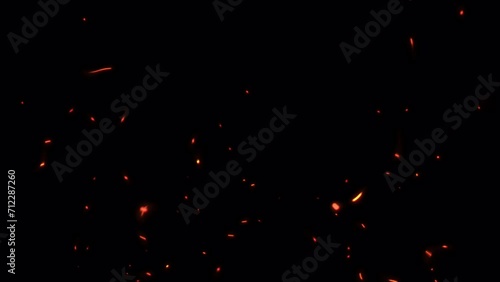 Loop Fire sparks rising up with transparent alpha channel can be used for overlay for your project. 4K 3D animation of fiery orange glowing flying ember burning ash particles.