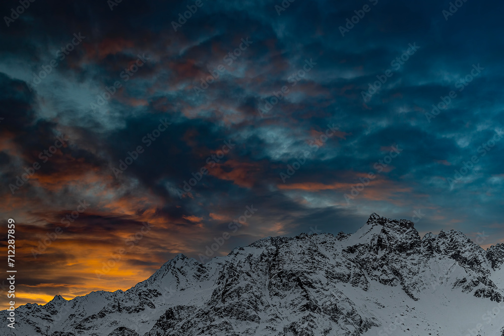 Dramatic sky at sunset over the Alps mountains, fine art landscape 