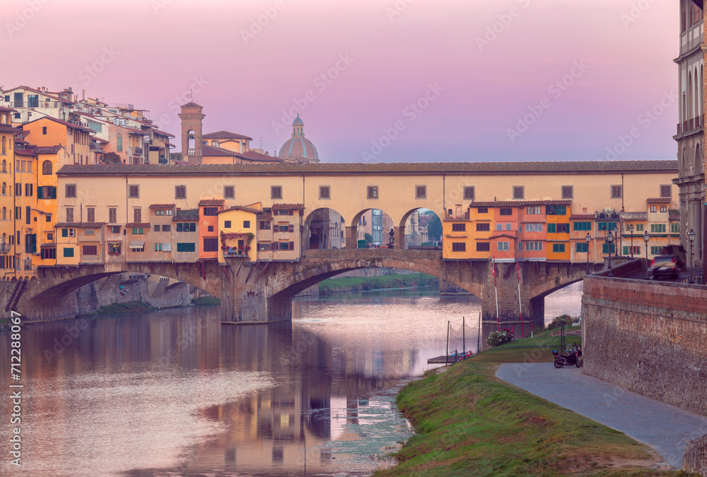 Golden bridge Ponte Vecchio in Florence at sunset.