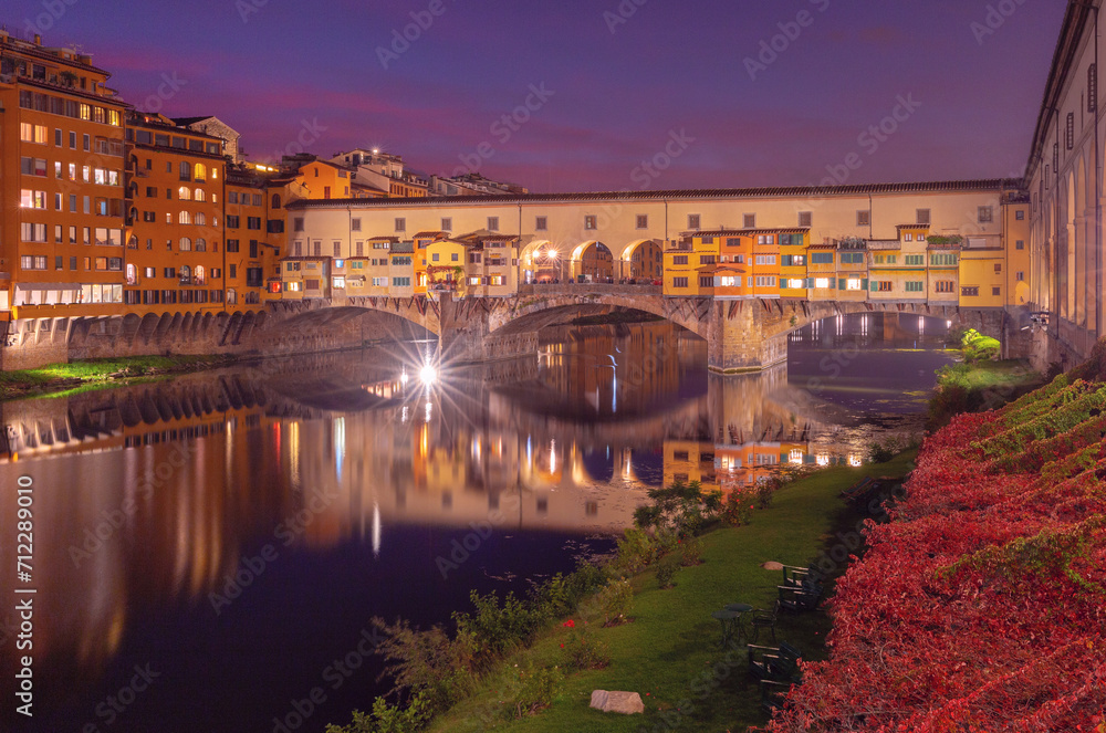 Golden bridge Ponte Vecchio in Florence at sunset.