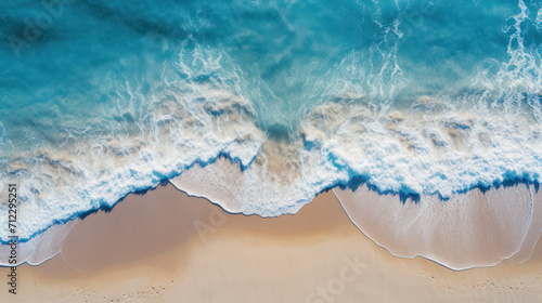 Top down view of tropical beach waves engulfing the sand © David