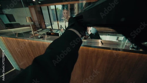 POV gun view of a bank robbery photo