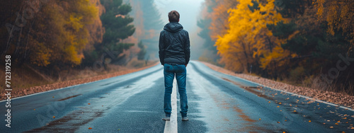 a man is standing on the road