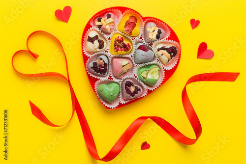 Fototapeta Naklejka Na Ścianę i Meble -  Valentine day composition: sweet candy, with gift boxes with bow and red felt hearts, photo template, background. Top View with copy space
