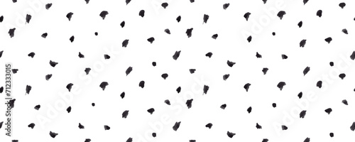 Dash pattern on white background. Wrapping paper with small black dots painted with a brush. Seamless simple minimal ornament. Abstract geometric grunge vector texture painted by ink