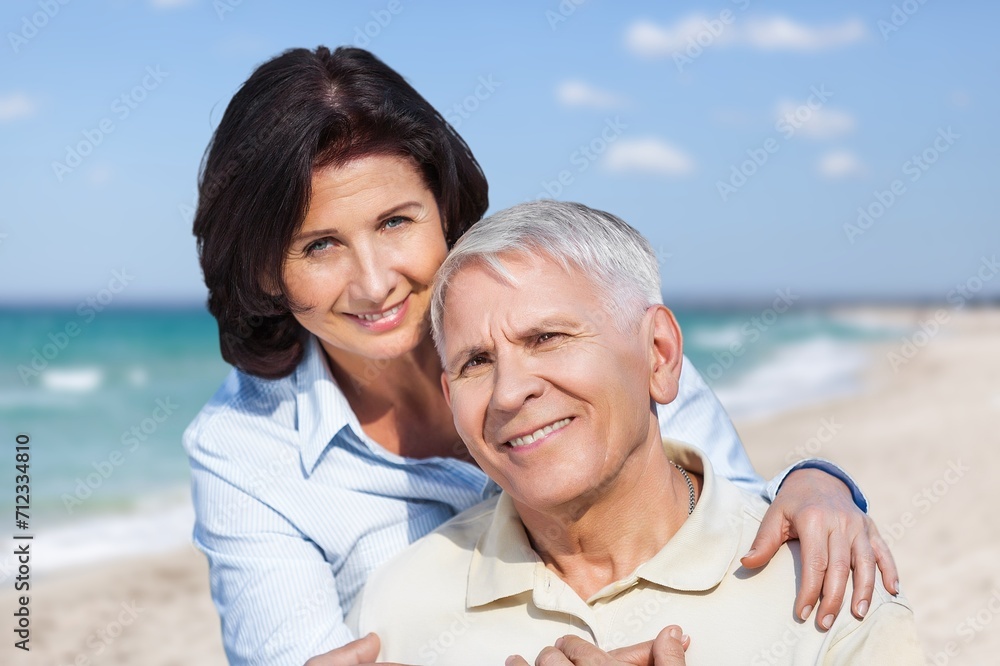 Happy senior couple have fun at the beach at vacation Happy senior couple have fun at the beach at vacation