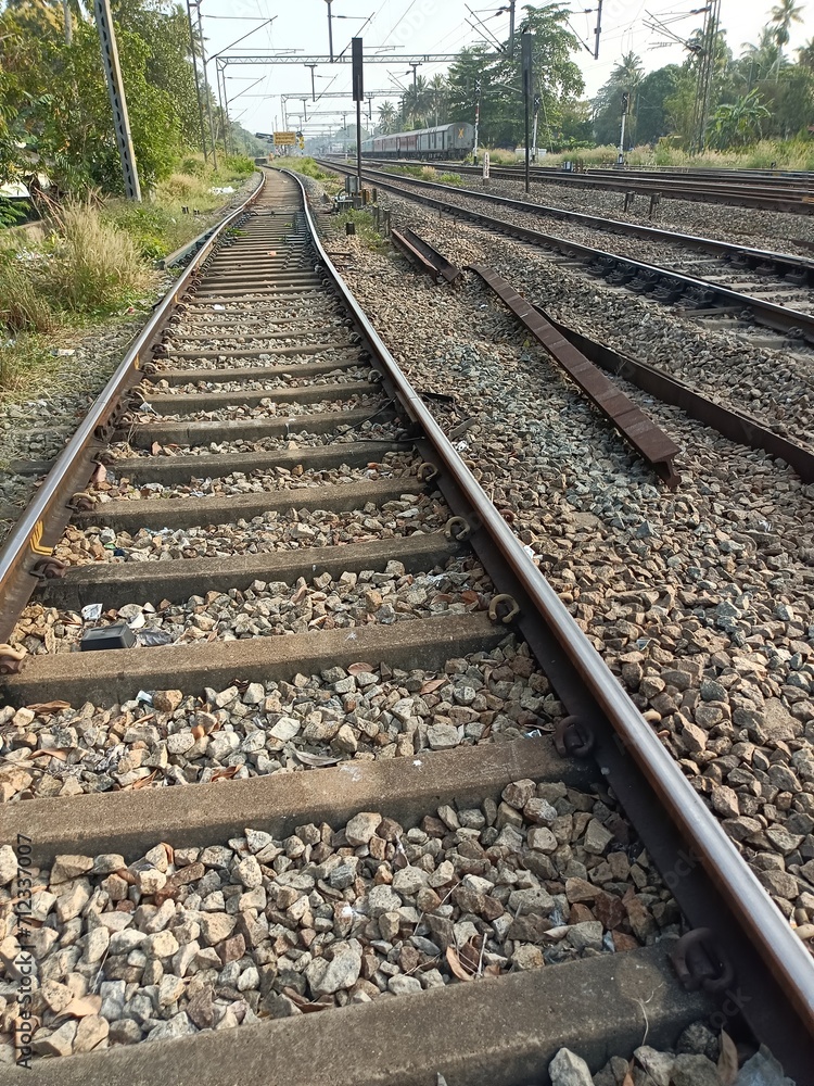 A railway track or railroad track, also known as a train track or permanent way, is the structure on a railway or railroad consisting of the rails, fasteners, railroad ties and ballast. A railway track or railroad track, also known as a train track or permanent way, is the structure on a railway or railroad consisting of the rails, fasteners, railroad ties and ballast.