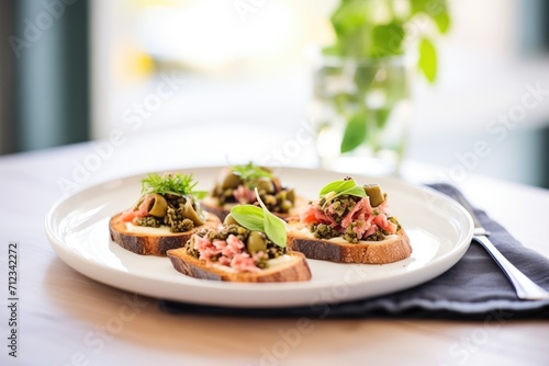 olive tapenade and feta bruschettas on ceramic plate