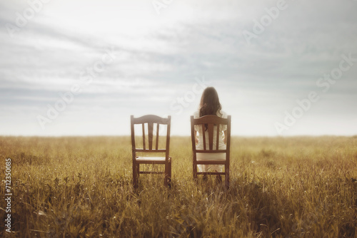 woman waits with pain sitting next to her lover's empty chair, abstract concept