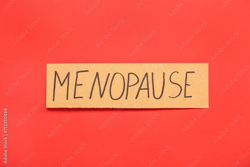 Word MENOPAUSE on red background Word MENOPAUSE on red background