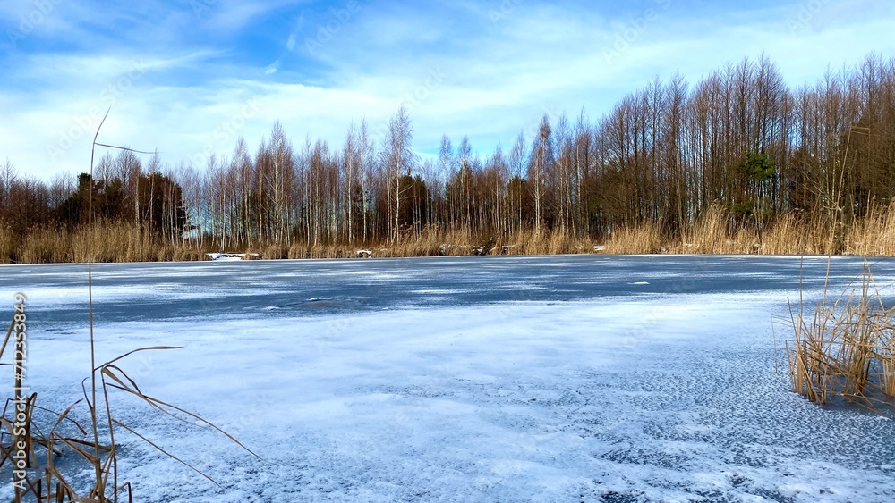 Winter landscape of a frozen lake in Poland Winter landscape of a frozen lake in Poland