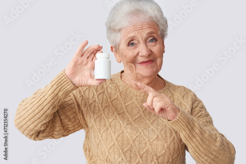 Senior woman pointing at pi...