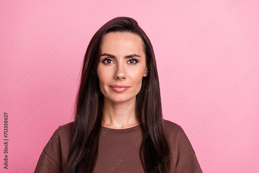 Portrait of lovely satisfied glad young girl nice long hair empty space ad isolated on pink color background Portrait of lovely satisfied glad young girl nice long hair empty space ad isolated on pink color background
