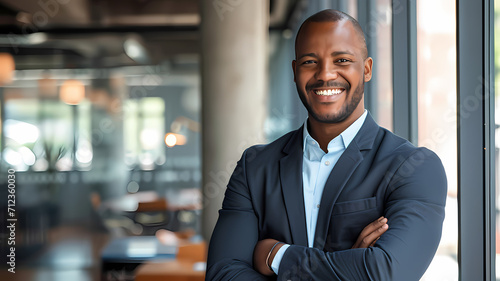 a portrait of a black male business man entrepreneur smiling  photo