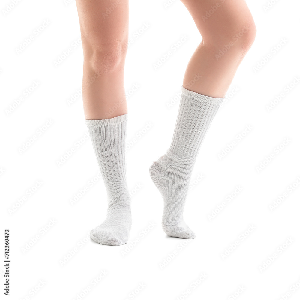 Legs of young woman in socks on white background