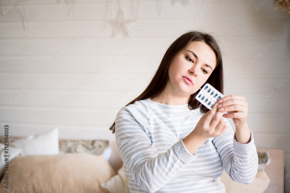 Girl holding pills in her hands. Pregnant woman holding medicine. Girl holding pills in her hands. Pregnant woman holding medicine.