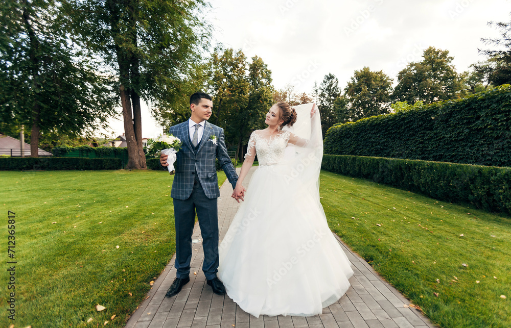 newlyweds together on a romantic walk newlyweds together on a romantic walk