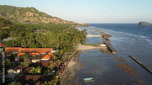 Drone view of Candi Dasa seaside town on the eastern coast of Bali, Indonesia photo