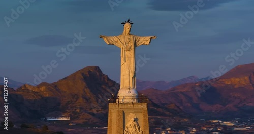 Aerial view of Statue of Chirst on Rocky Hilltop, Monteagudo Castle, Murcia photo