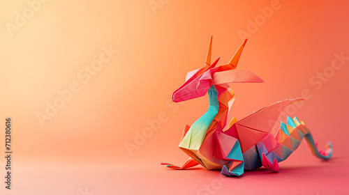 Colorful dragon origami on a peach fuzz background