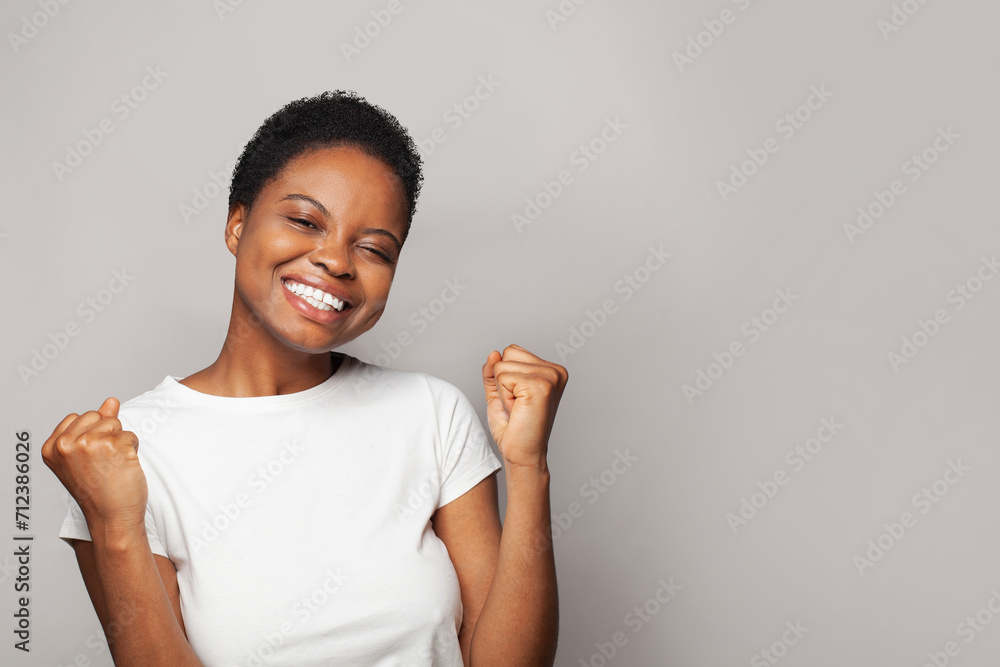 Surprised happy woman smiling and having fun against white studio wall background, emotional expression portrait - obrazy, fototapety, plakaty 