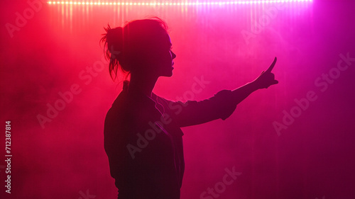 Woman points to the side black background purple colors neon