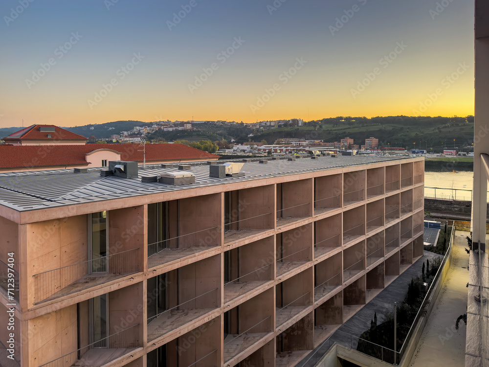 Obraz premium Modern building in the city of Coimbra. At the end of the day.