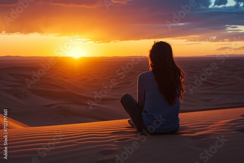 Woman enjoying sunset on a desert dune © Areesha