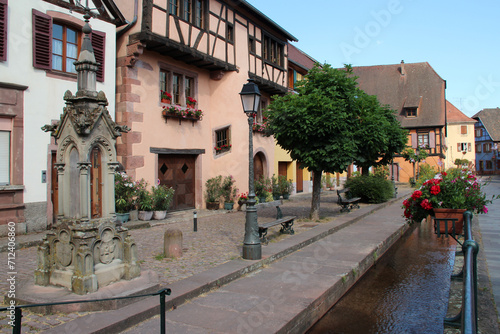 canal and old houses in ribeauvill   in alsace in france