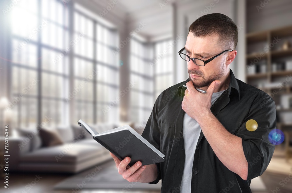 Young happy man read book at home Young happy man read book at home