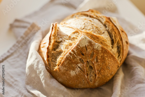 Freshly baked sourdough bread on table