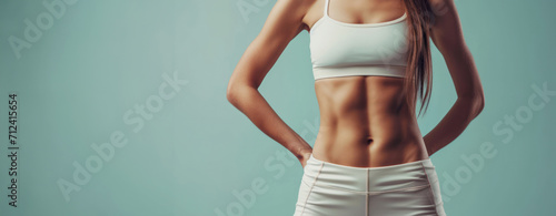 Generative AI, Sporty woman with great abdominal muscles shows stomach in sportswear on neutral background photo