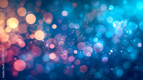 Unfocused multicolored bokeh on a blue background photo