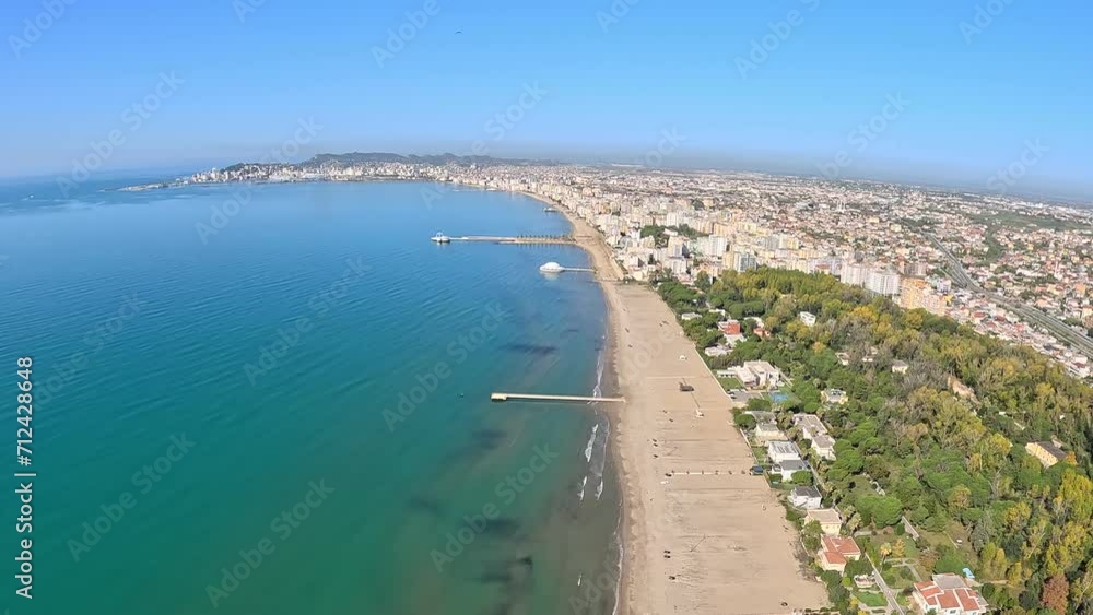 Aerial panorama of Durres, a popular Albanian beach resort town with wide sandy beaches and coastal hotels. Aerial panorama of Durres, a popular Albanian beach resort town with wide sandy beaches and coastal hotels.