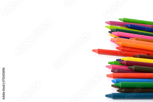 Crayons lined up isolated on white background.