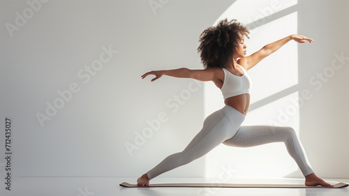 Woman doing yoga.  Working out, wearing sportswear bra and pants, full length photo