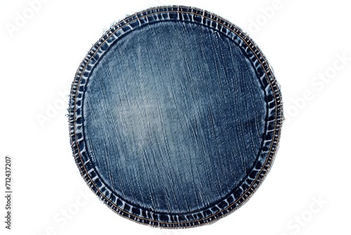 Round blue denim plate on a white background. Perfect for food or kitchen-related designs photo