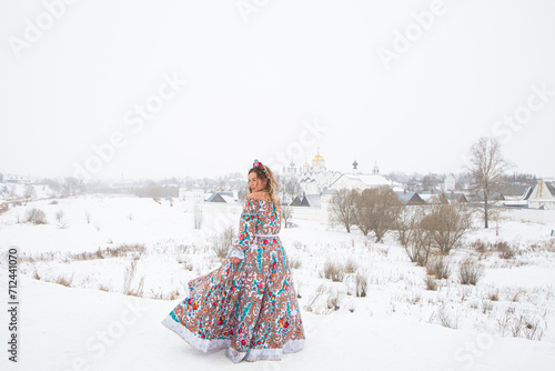 beautiful Russian girl in a winter national dress