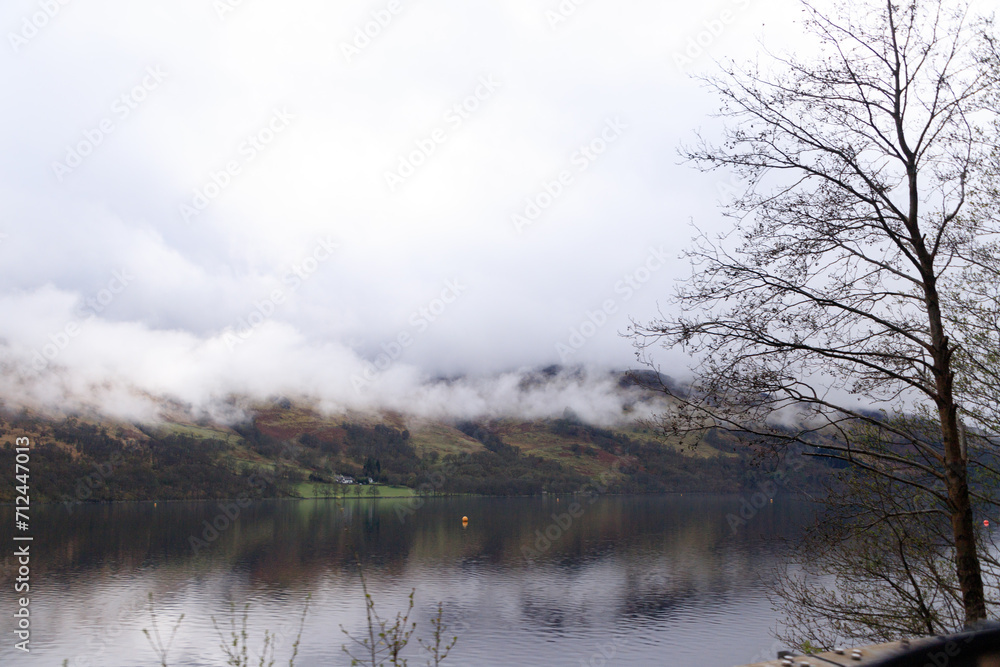 Golden Hills Reflection on a Tranquil Scottish Lake Golden Hills Reflection on a Tranquil Scottish Lake