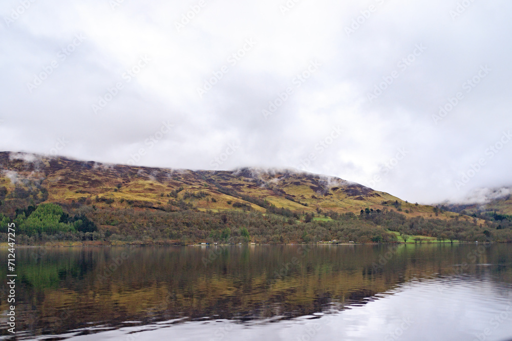 Golden Hills Reflection on a Tranquil Scottish Lake