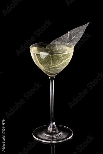 Red line cocktail glass on black background. Alcohol cocktail drink, close-up. Modern alcoholic beverage photo