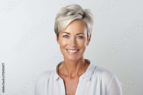 Portrait of a beautiful middle-aged woman with short hair.