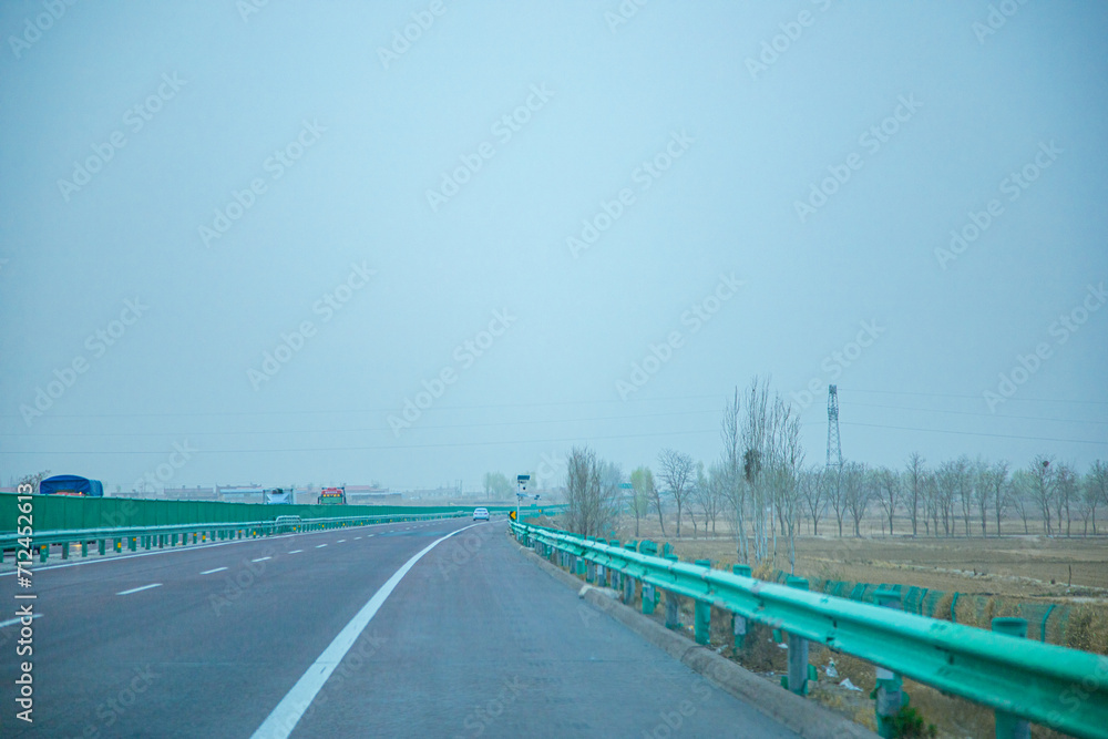 Fototapeta premium Pingliang City, Gansu Province - Road and field scenery under the blue sky
