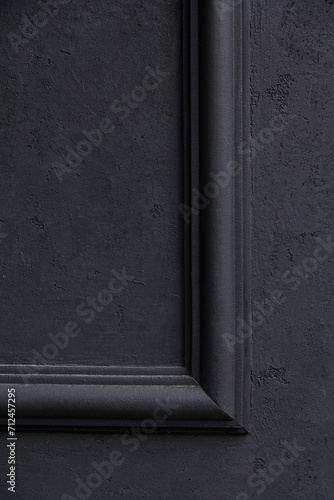 Closeup dark grey cornice molding on the wall.Background .Texture