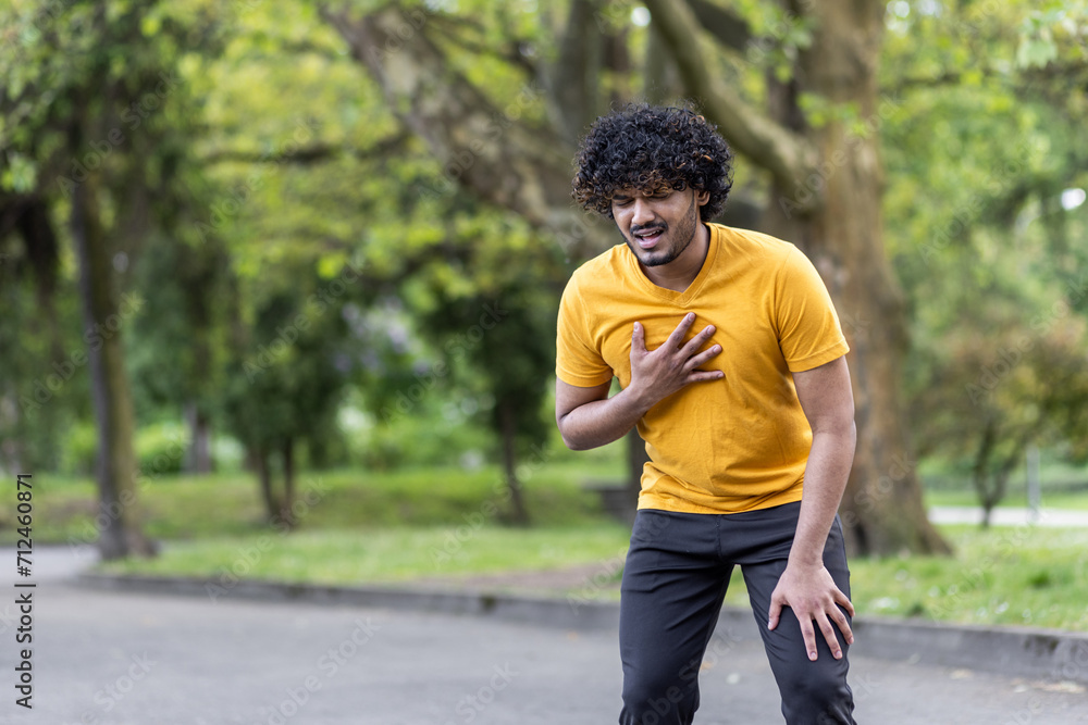 Indian sportsman running in park, fitness enthusiast exercising outdoors Indian sportsman running in park, fitness enthusiast exercising outdoors