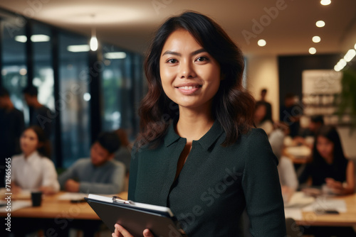 Woman Holding Tablet in Front of Group