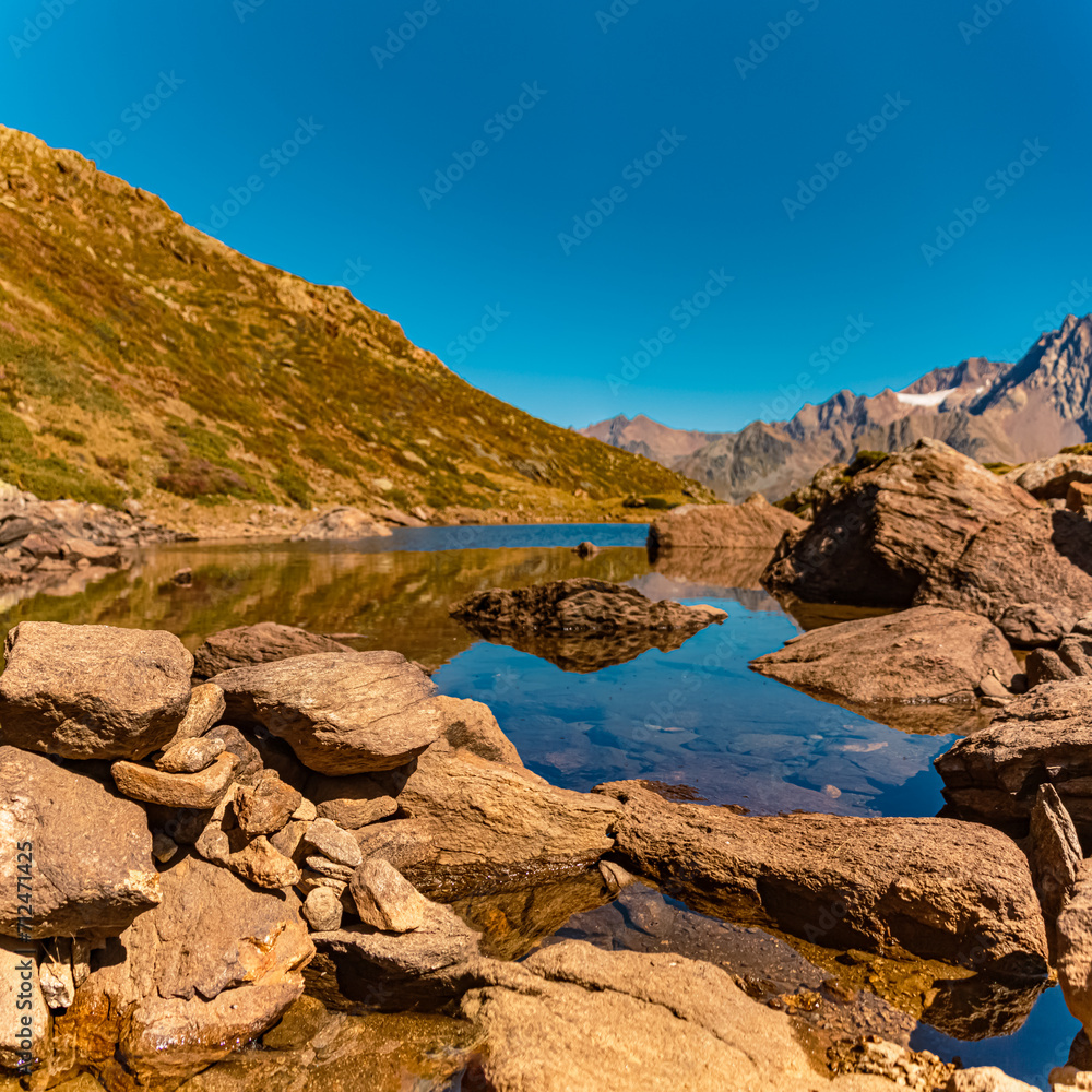 High resolution stitched alpine summer panorama with reflections in Lake Seeles at the famous Kaunertal Glacier Road, Landeck, Tyrol, Austria