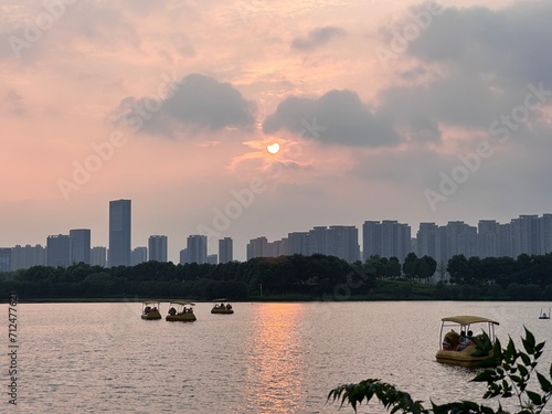 Yanghu Wetland Park, a famous tourist site in Changsha, China. Pedal boats on the lake during sunset. photo