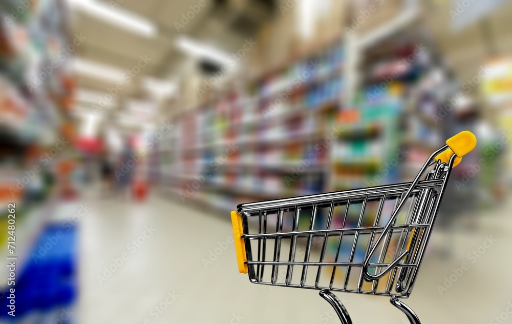 A shopping cart at store with full a supermarket A shopping cart at store with full a supermarket